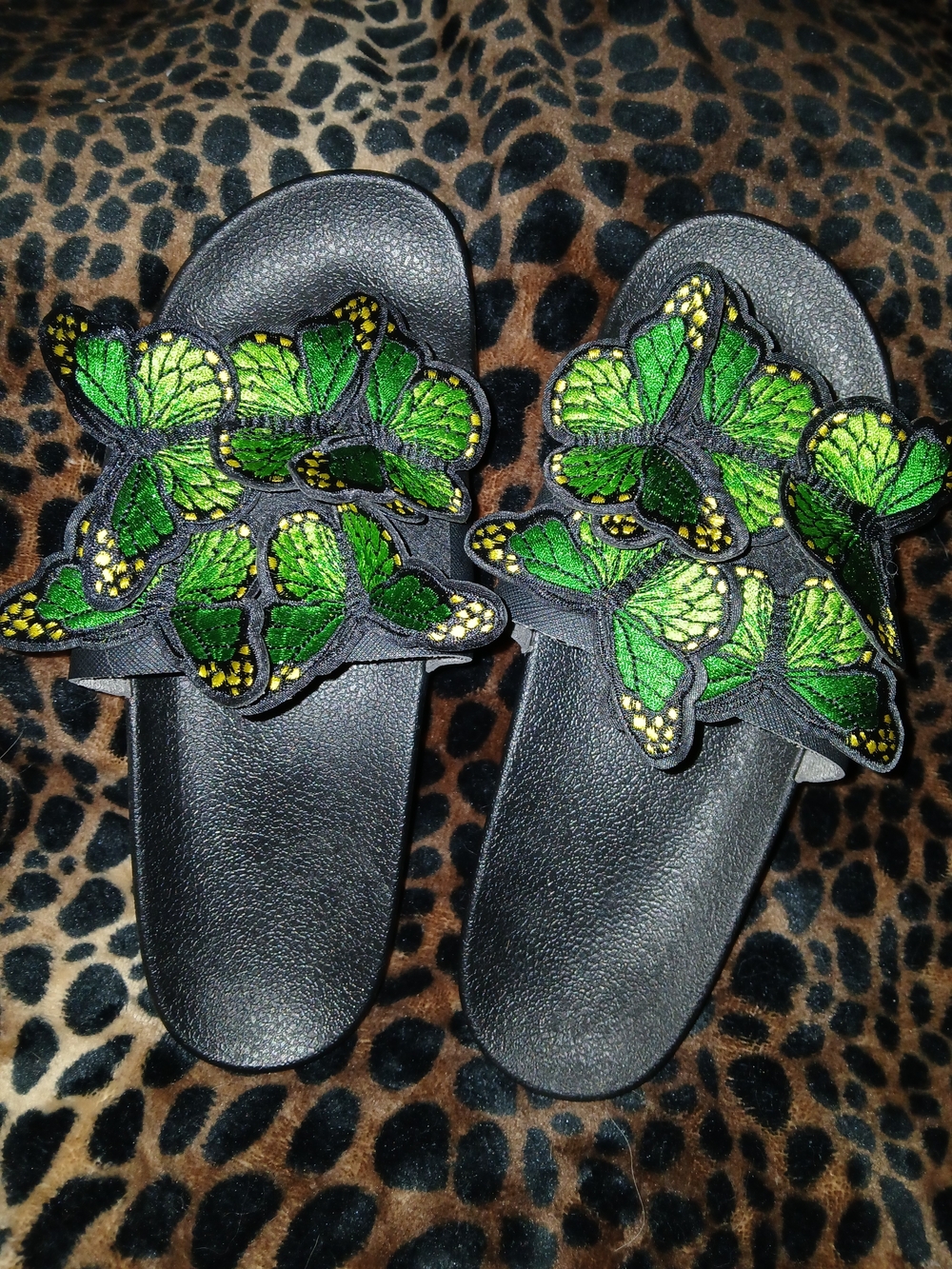 DOLLS KILL Black Slide Sandals with Green Butterfly Embellishments